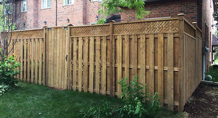 Tall wooden privacy fence